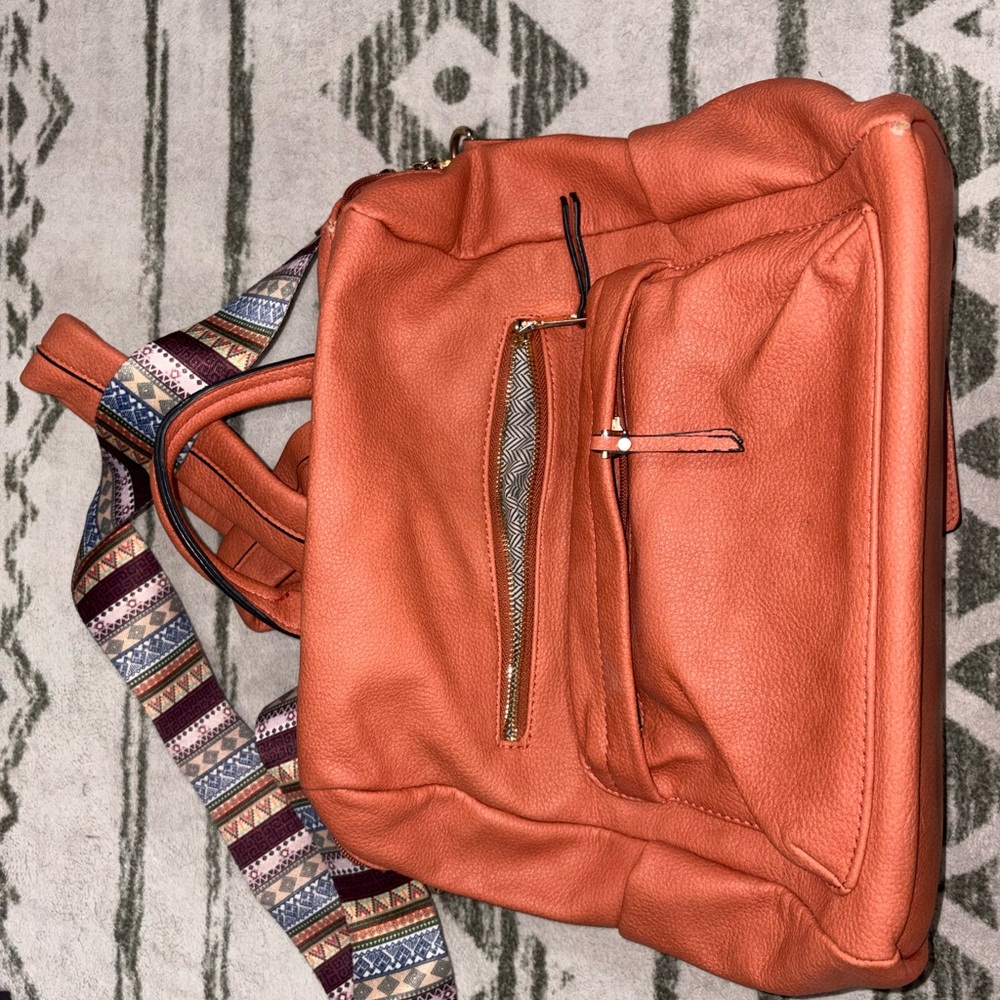 Stylish Orange Backpack With Patterned Strap - image 1